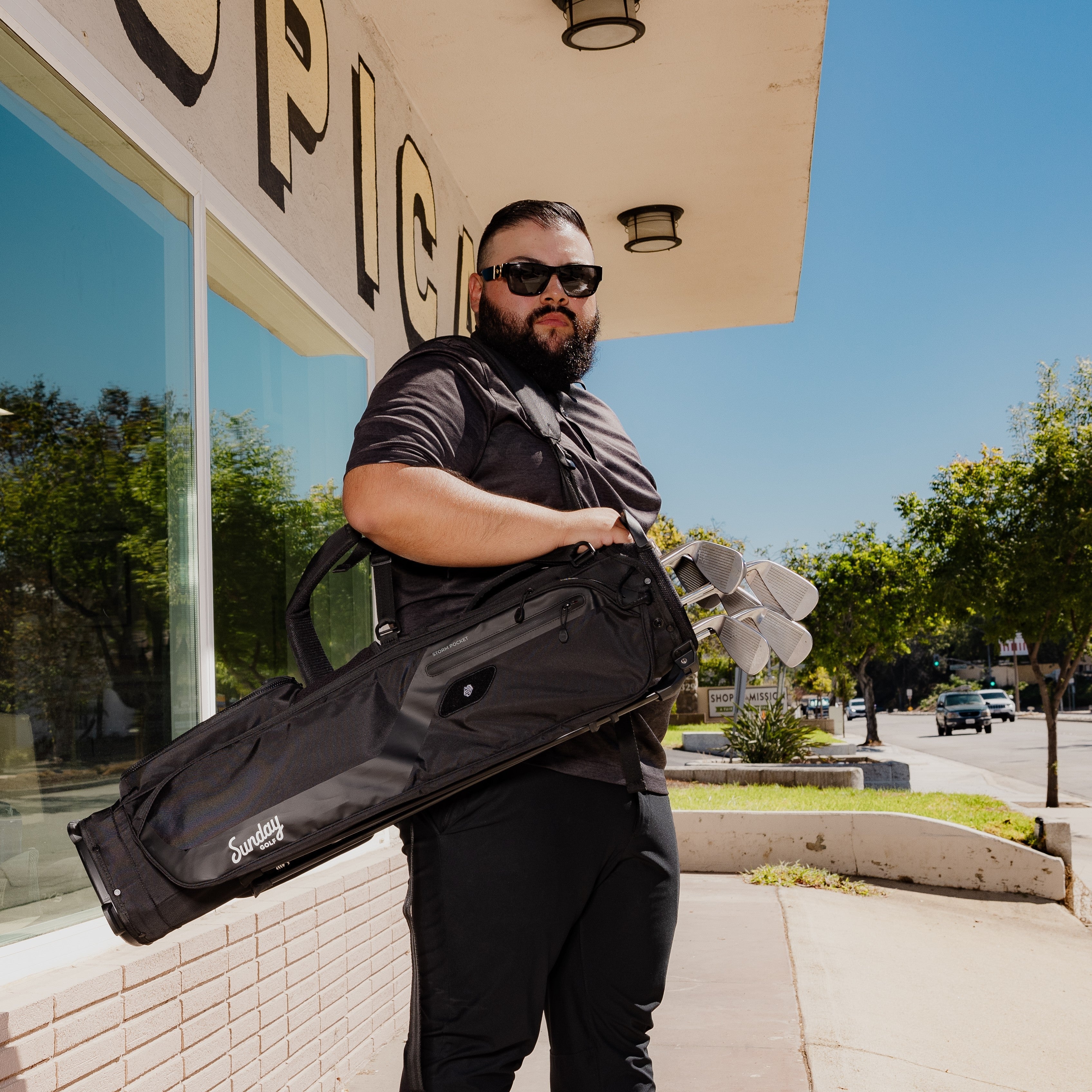man carrying el camino golf bag